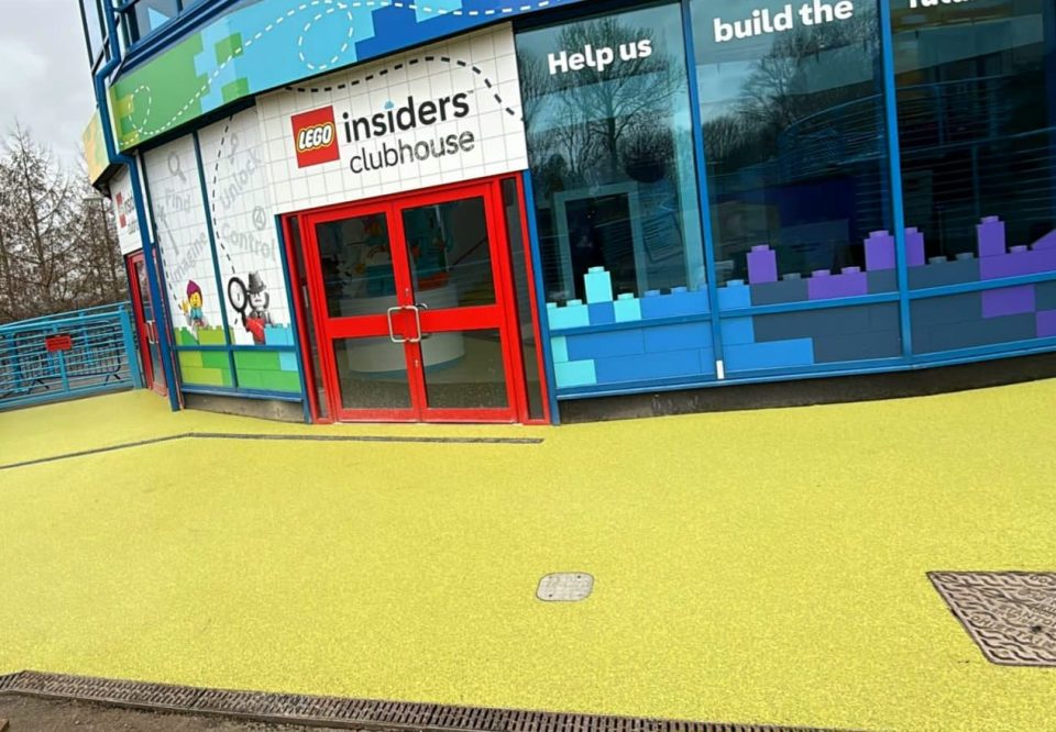 Yellow pigmented quartz resin bound surface with seamless, permeable finish